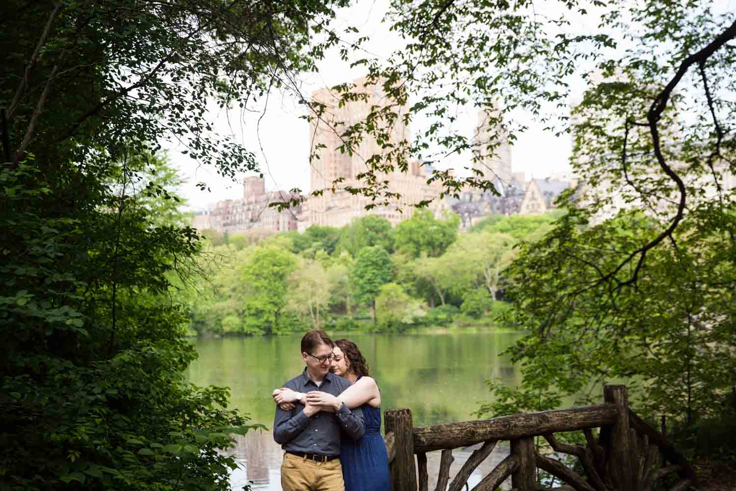 Couple hugging with Central Park lake in background