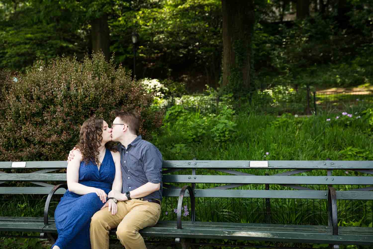 Couple kissing on Central Park bench