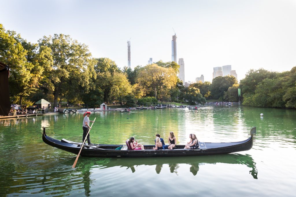 Gondola boat ferrying people in Central Park lake