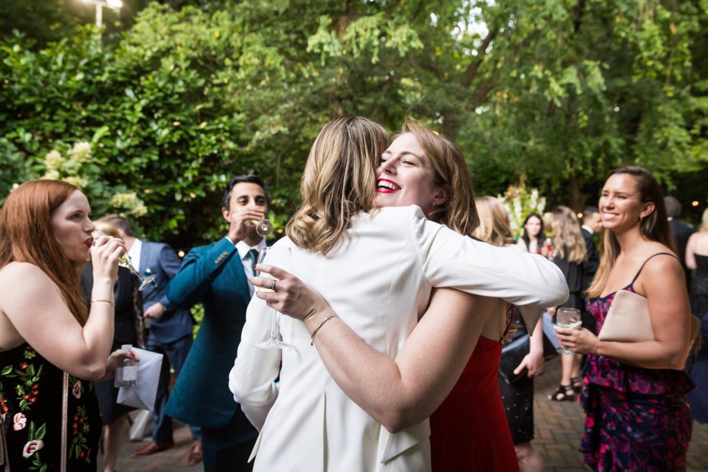 Guest hugging bride at Central Park wedding cocktail party