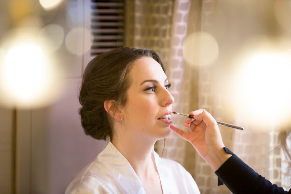 Bride having lipstick applied at a Water Club wedding