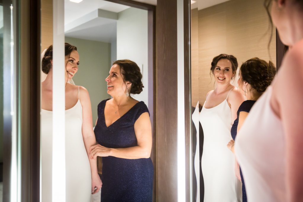 Mother and bride reflected in mirror