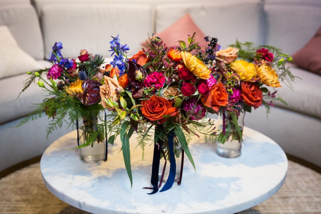 Three flower bouquets on a table