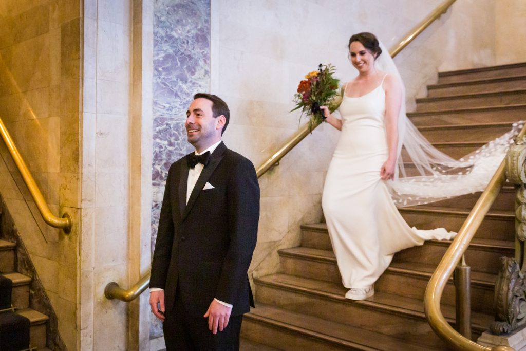 Bride and groom first look in Grand Central Terminal at a Water Club wedding