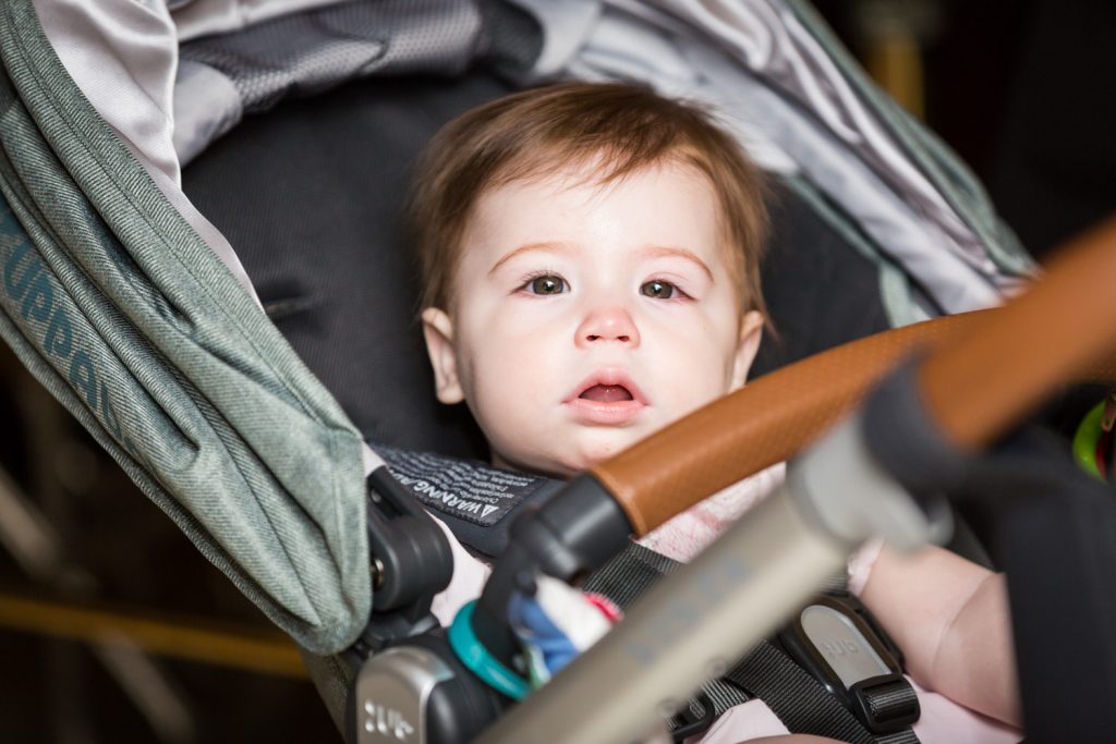 Baby in a stroller about to be baptized