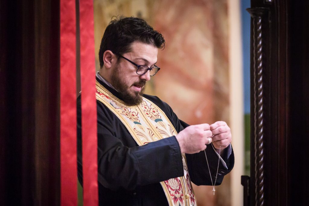 Greek orthodox baptism photos of priest with cross necklace
