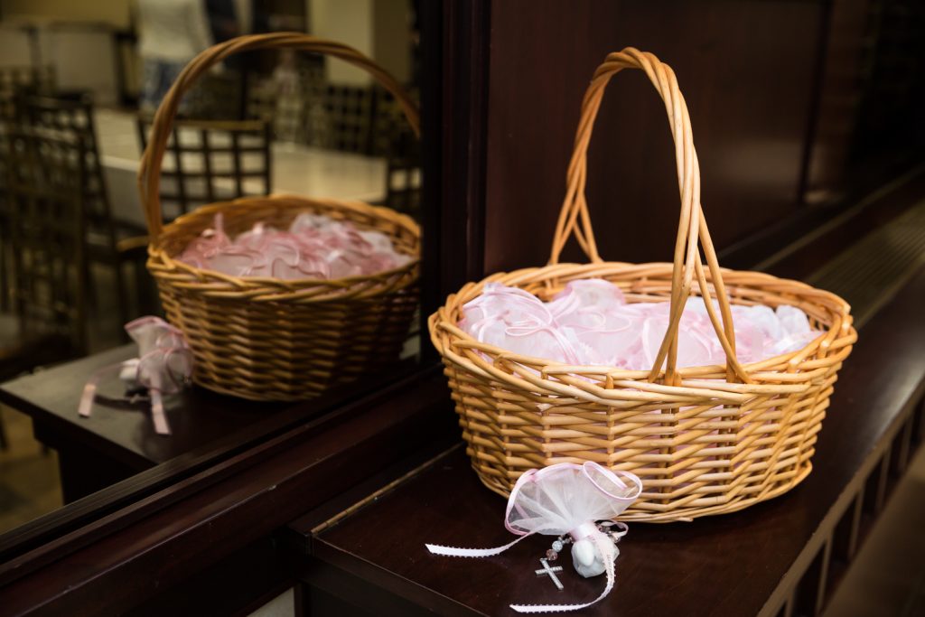 Basket with guest favors of sugared almonds at a Greek baptism