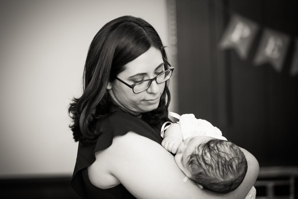 Black and white photo of mother holding child
