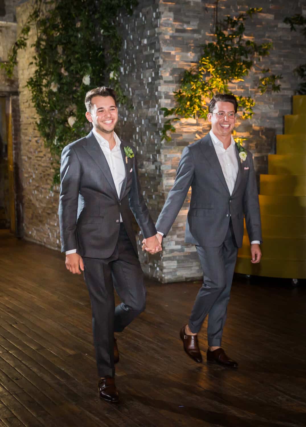 Greenpoint Loft wedding photos of two grooms entering reception