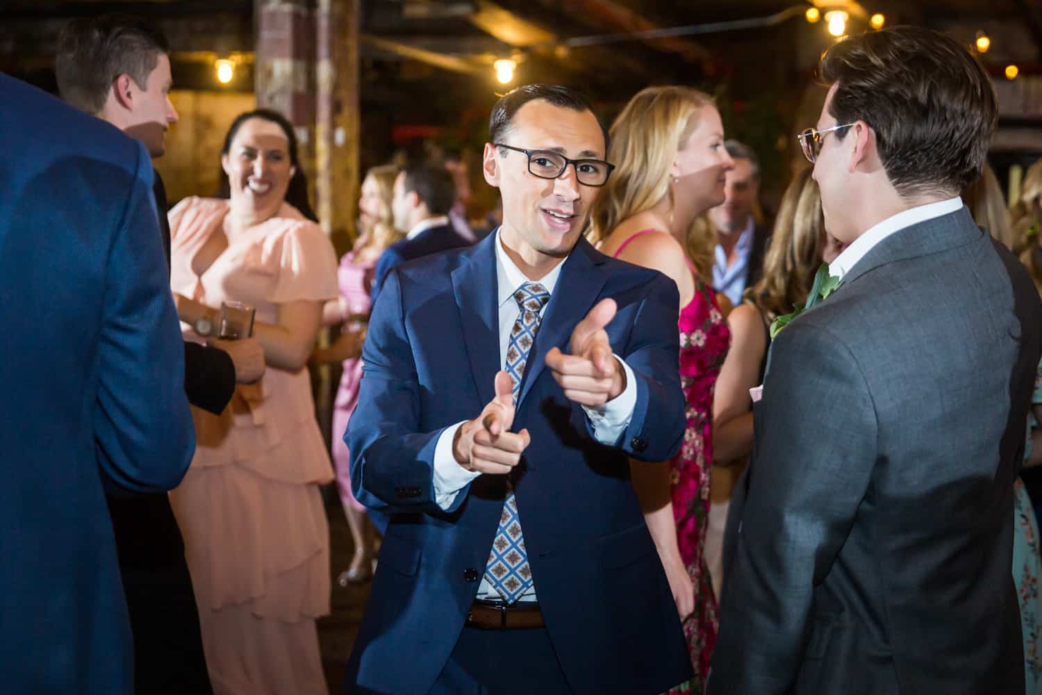 Greenpoint Loft wedding photos of guest dancing and pointing to camera