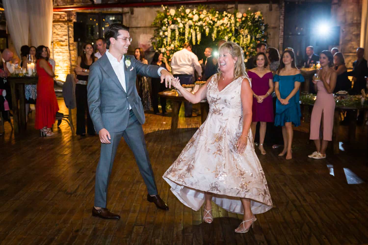 Greenpoint Loft wedding photos of groom dancing with mother