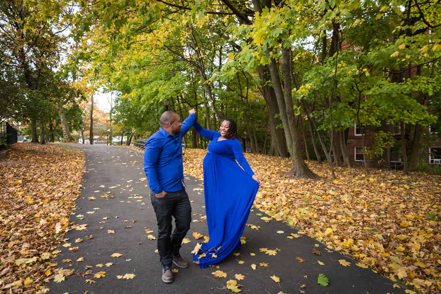 African American couple dancing in Forest Park for an article on maternity photo shoot ideas