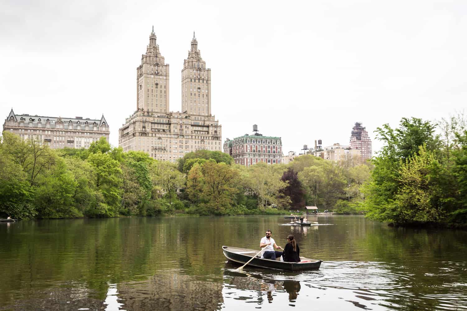 Couple in boat at a surprise proposal on Central Park Lake