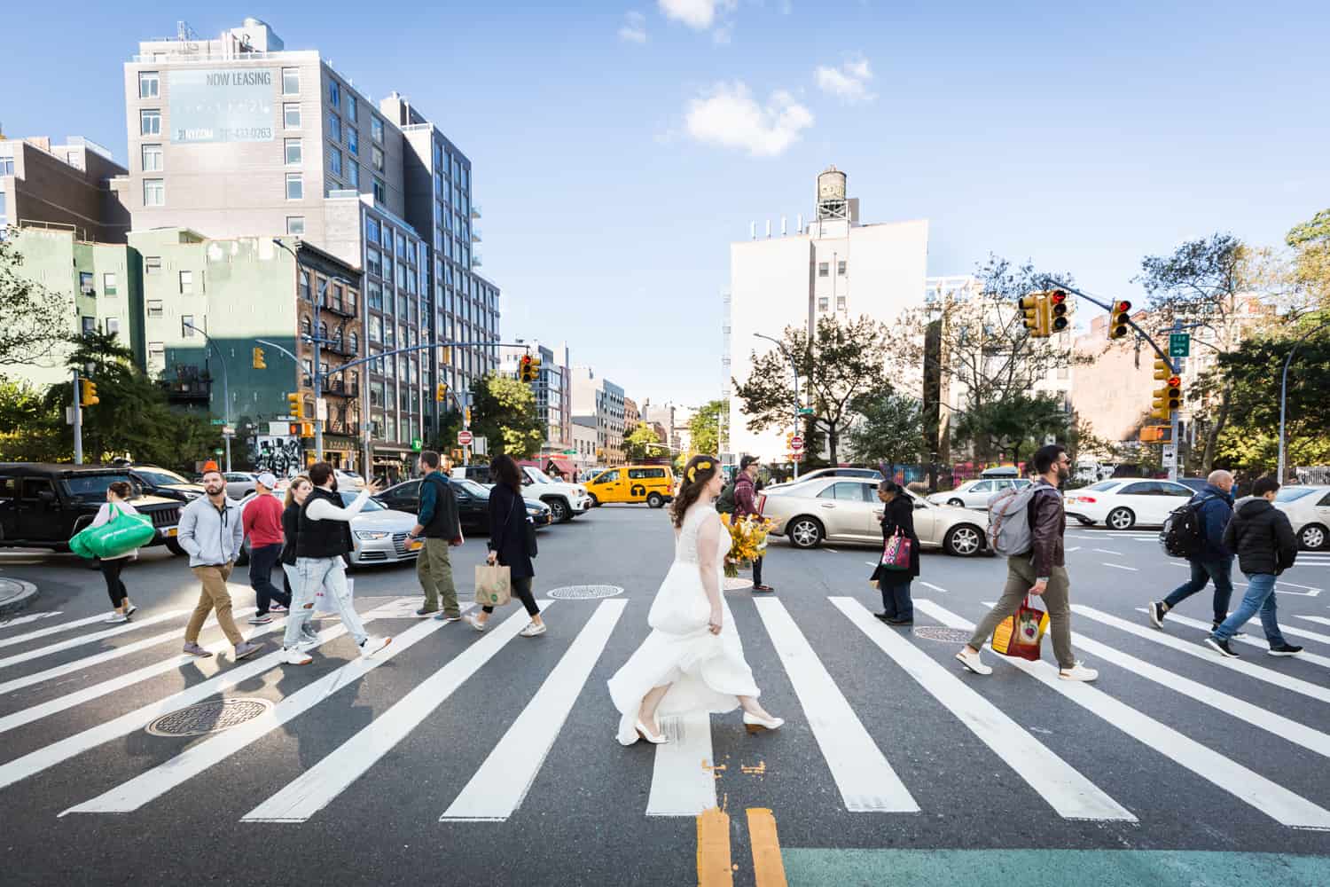 Bride crossing NYC street in crosswalk
