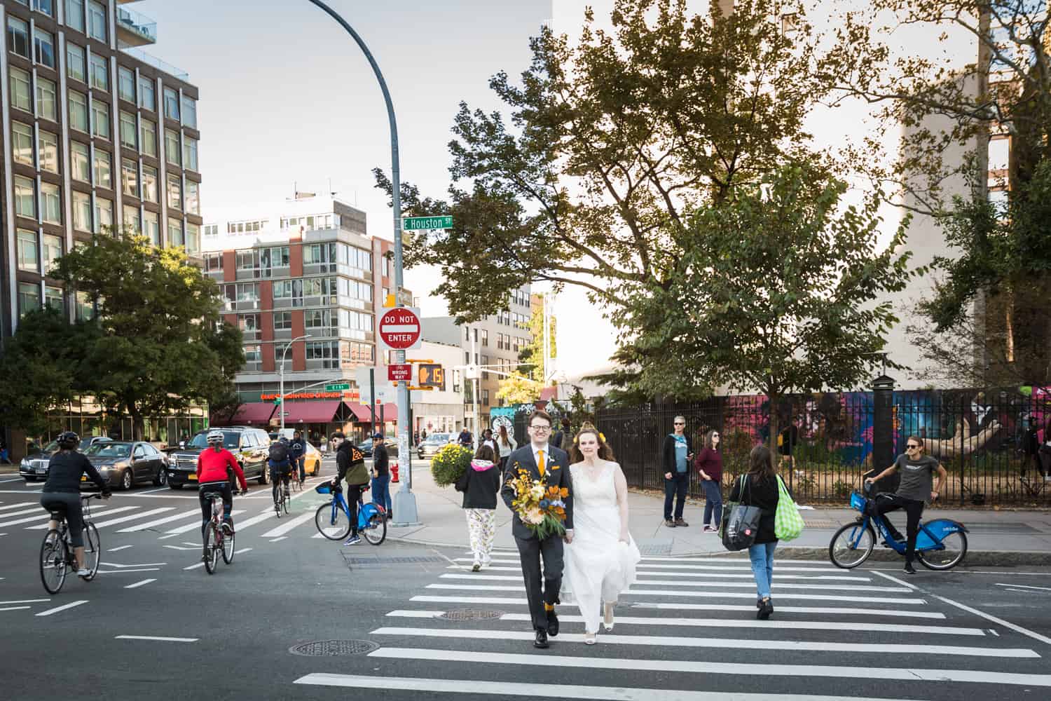 Bride and groom walking in crosswalk for an article on Covid-19 wedding planning
