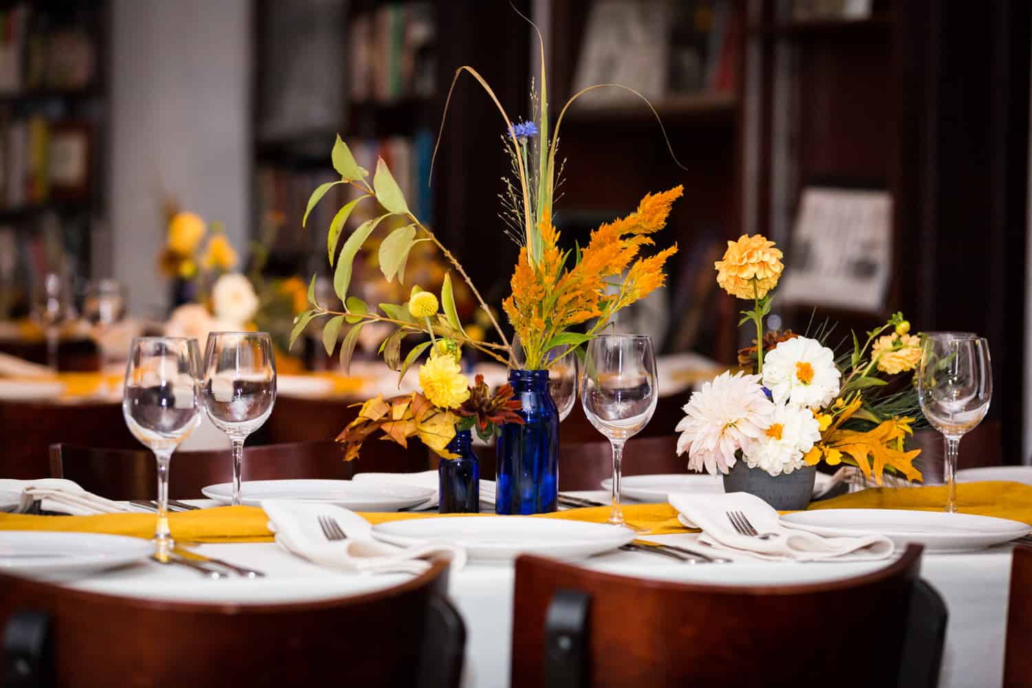 Reception table with floral centerpiece for an article on Covid-19 wedding planning