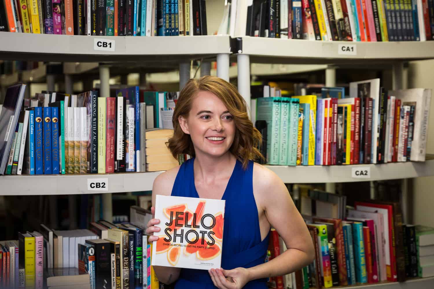Bridesmaid holding book entitled, 'Jello Shots'