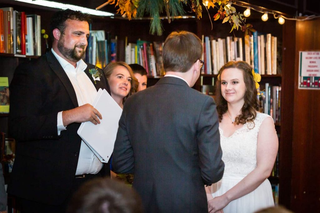Bride and groom exchanging vows during ceremony for an article on Covid-19 wedding planning