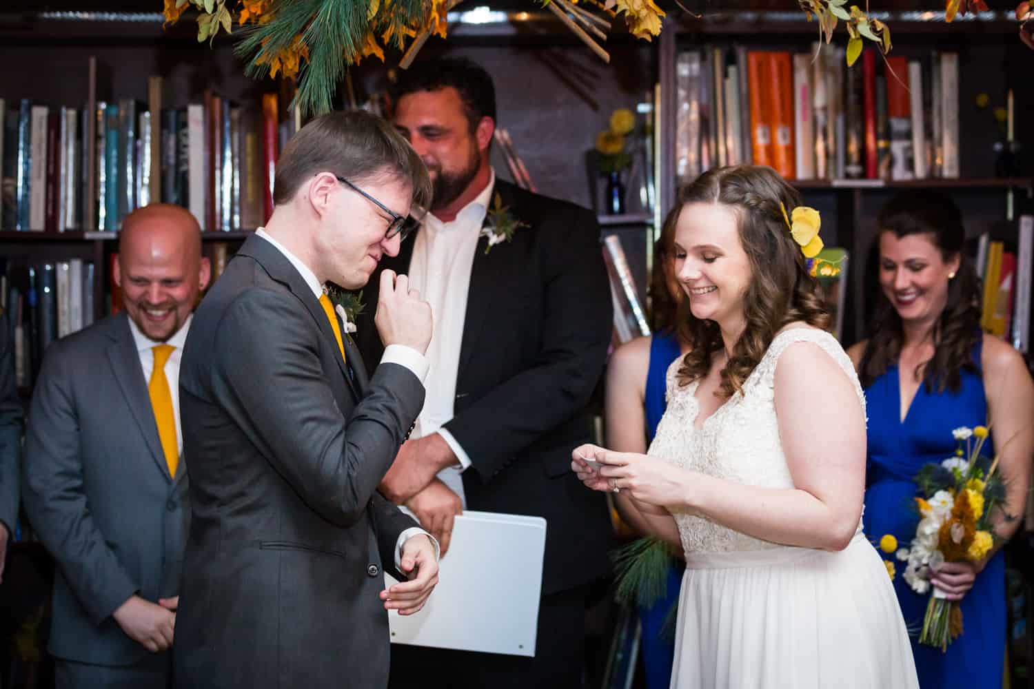 Bride and groom laughing during ceremony for an article on Covid-19 wedding planning