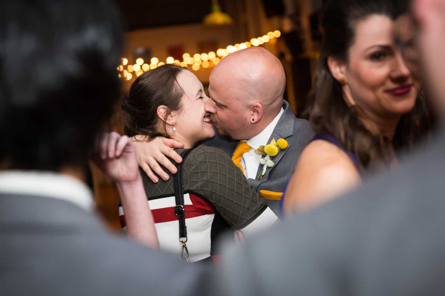 Couple kissing during reception