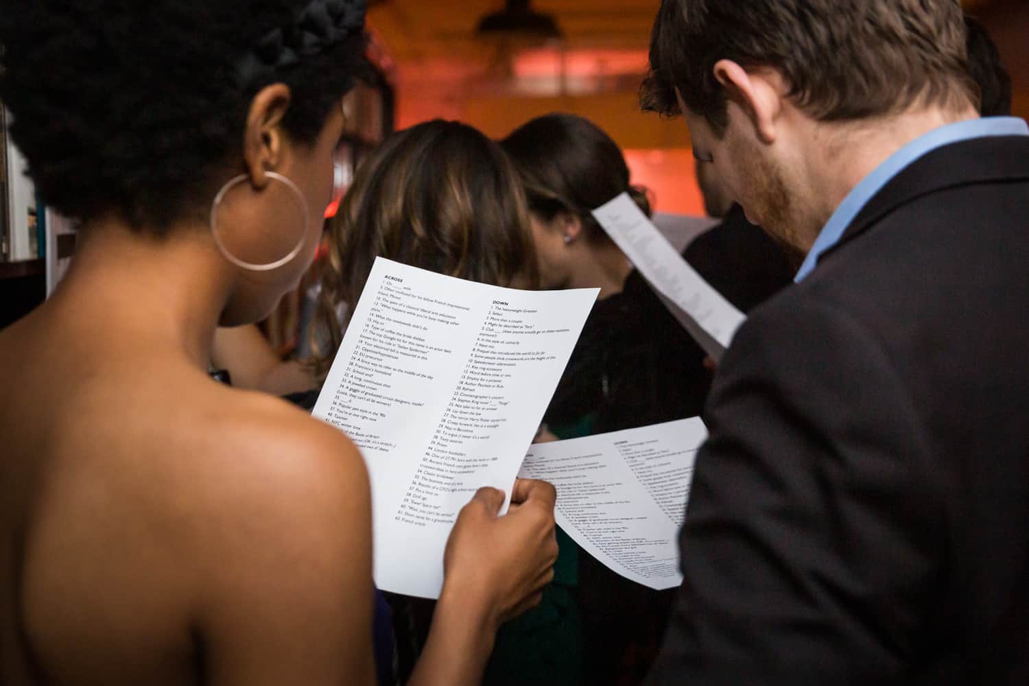 Guests reading crossword puzzle clues