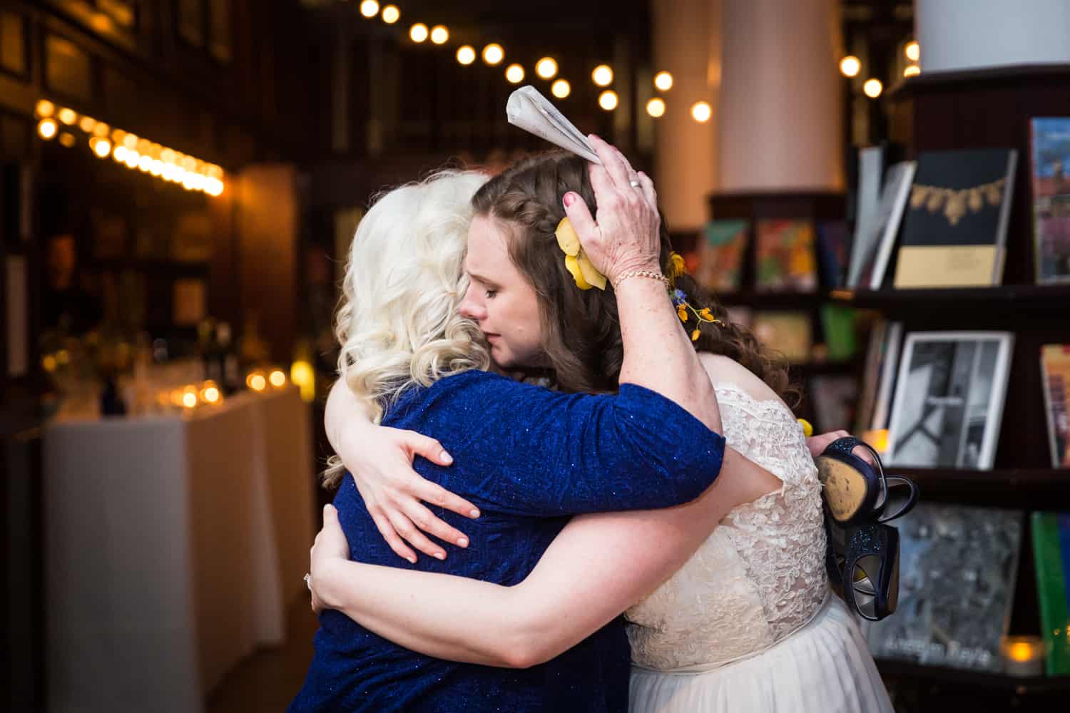 Bride hugging mother at a Housing Works Bookstore Cafe wedding
