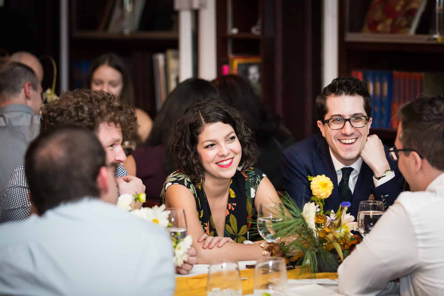 Guests laughing during reception at a Housing Works Bookstore Cafe wedding