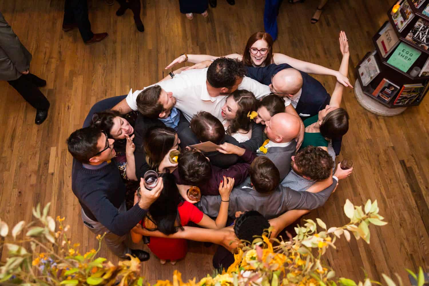 Guests dancing in tight circle at a Housing Works Bookstore Cafe wedding