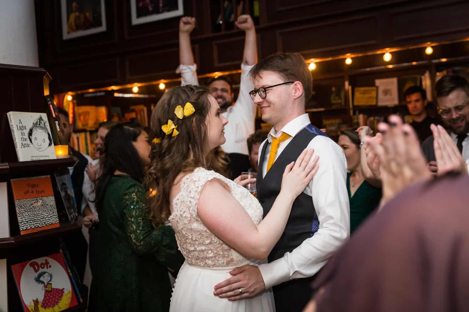 Bride and groom hugging on dance floor for an article on Covid-19 wedding planning