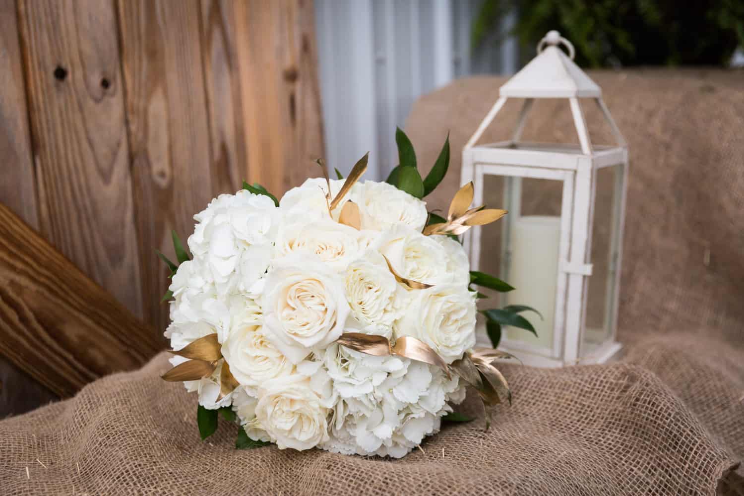 Bridal bouquet of white roses for an article on wedding cost cutting tips