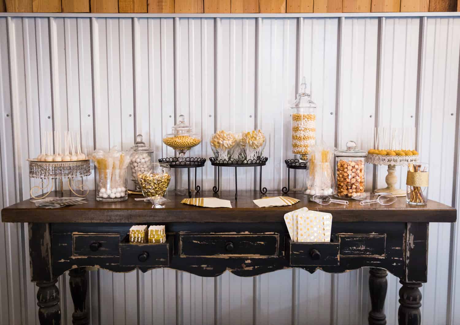 Candy buffet with gold-colored candies on table