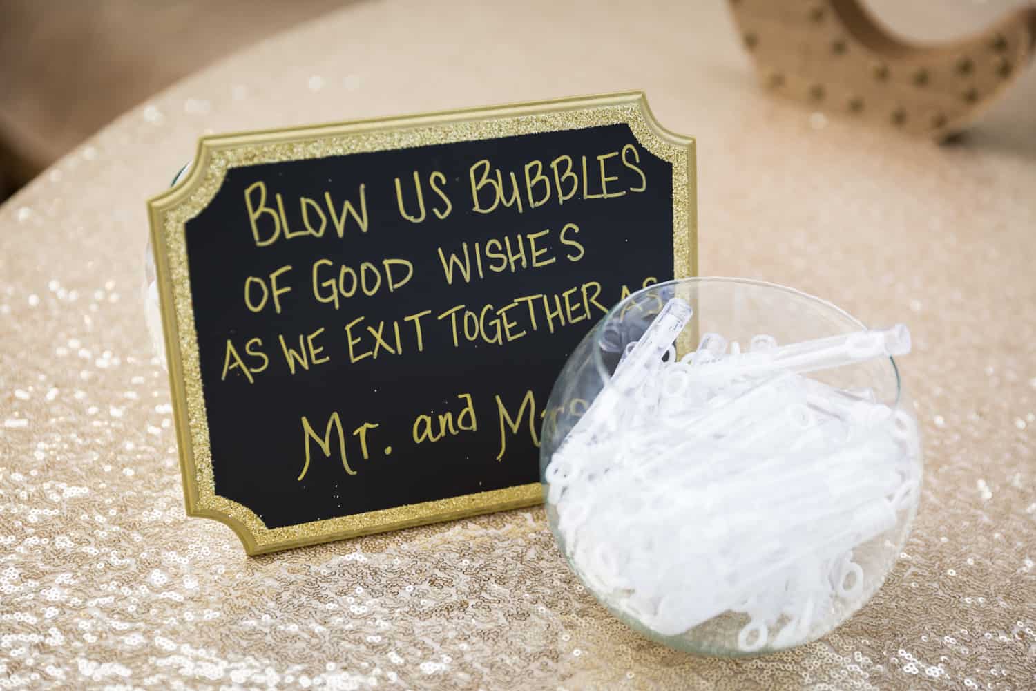 Bowl of bubbles with sign for guests
