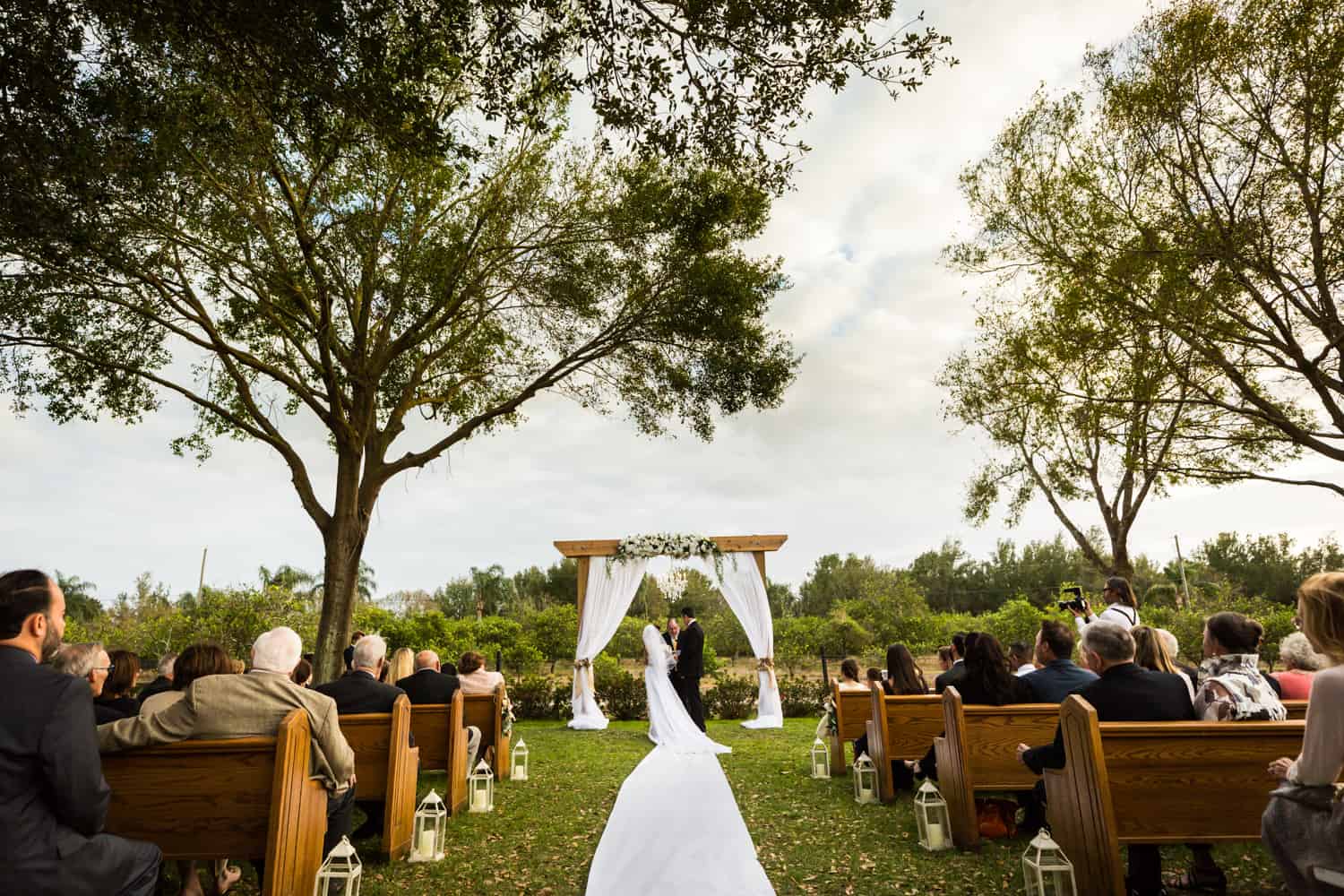 Wide shot of outdoor ceremony for an article on wedding cost cutting tips