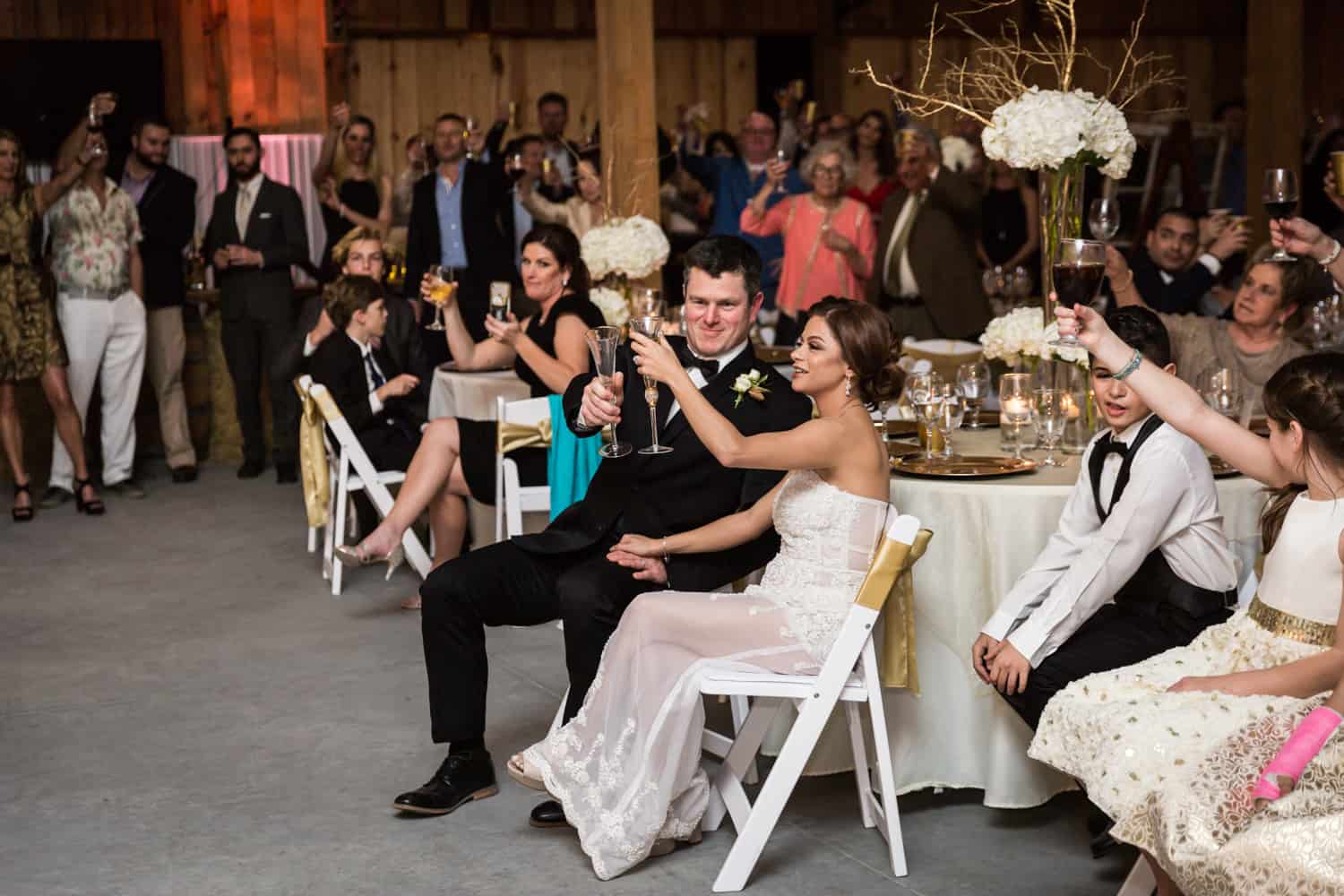 Bride and groom toasting champagne glasses for an article on wedding cost cutting tips