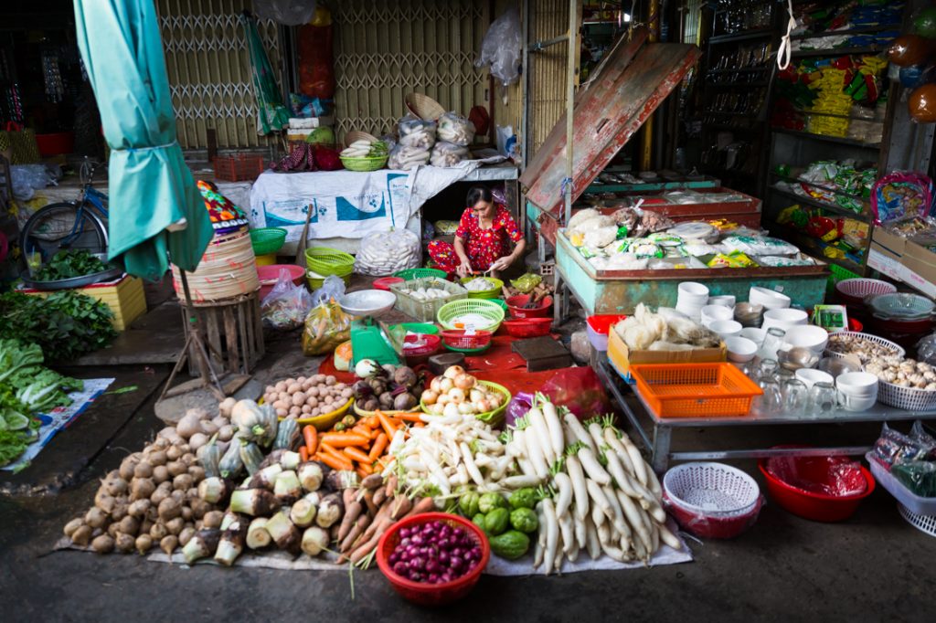 Woman selling vegetables in a Vietnamese market