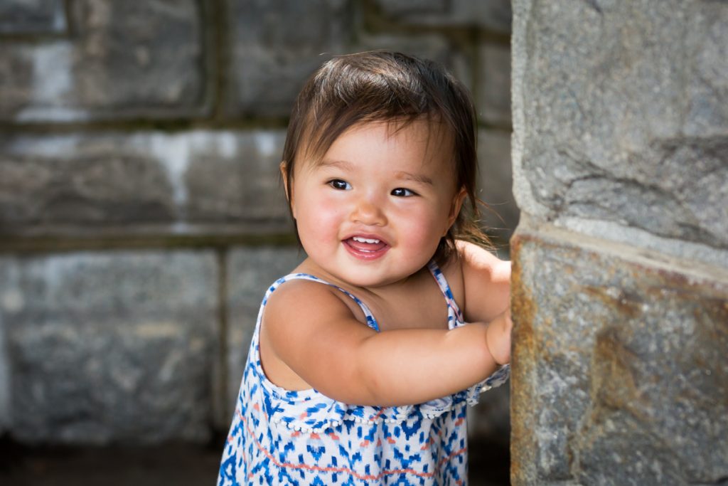 Little girl smiling during Belvedere Castle family portrait in Central Park