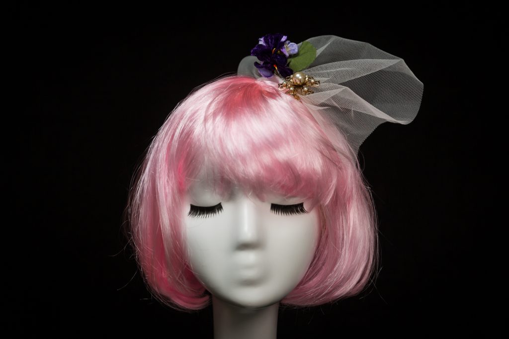 Pink haired mannequin wearing mini bridal veil by Chapeau A Go Go