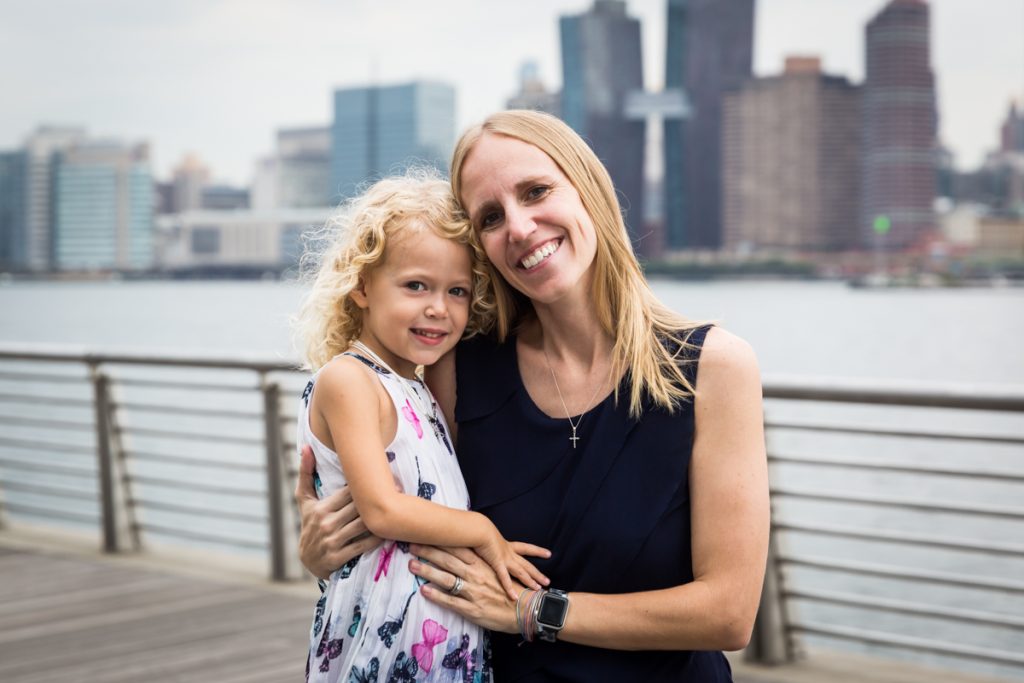 Mother and daughter on boardwalk during a Gantry Plaza family portrait session