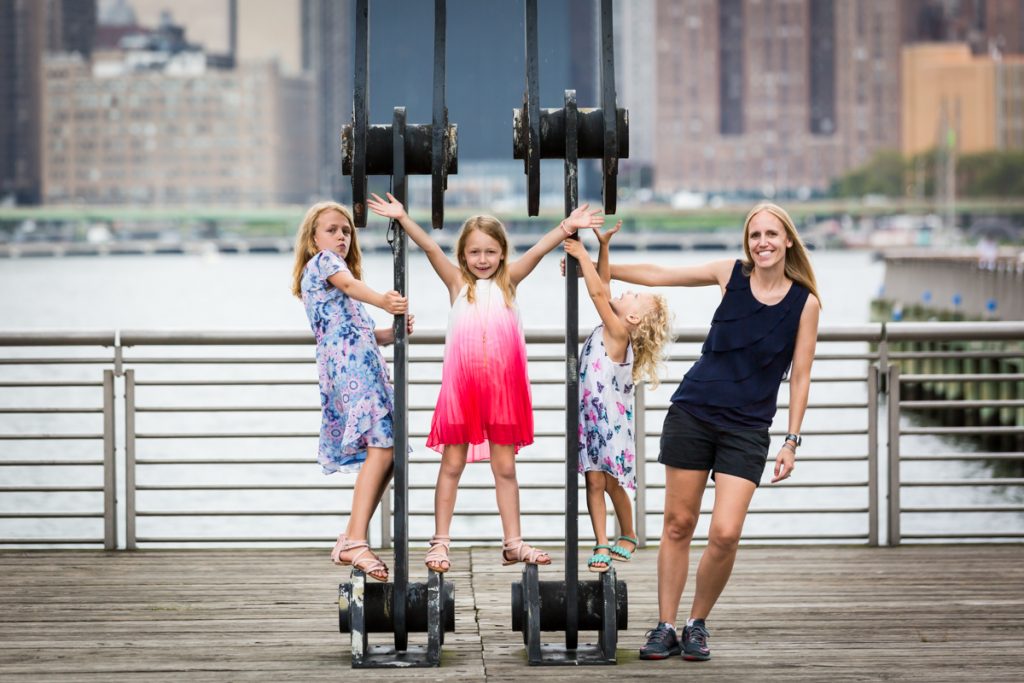 Mother and three daughters playing on gantry at Gantry Plaza State Park