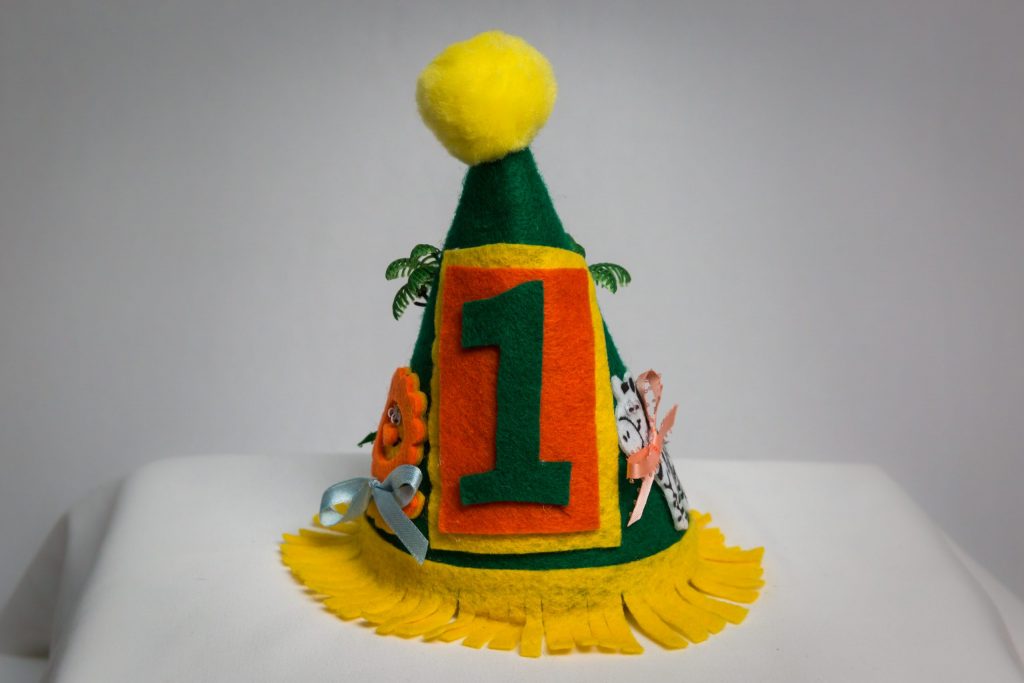 Green and yellow first birthday party hat