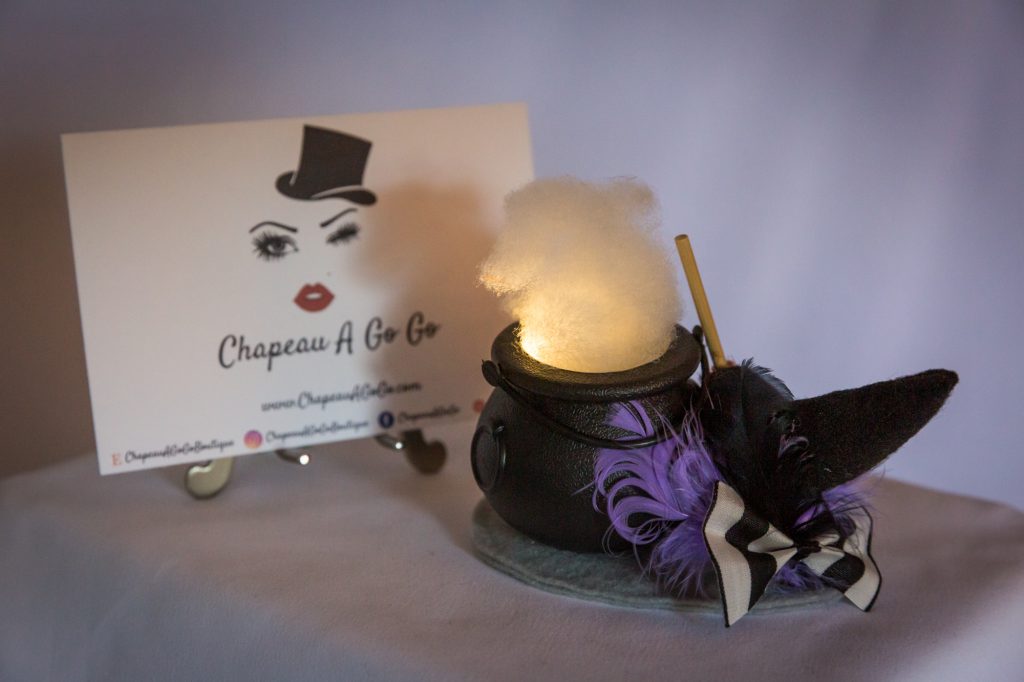 Black and purple witch cauldron fascinator that lights up