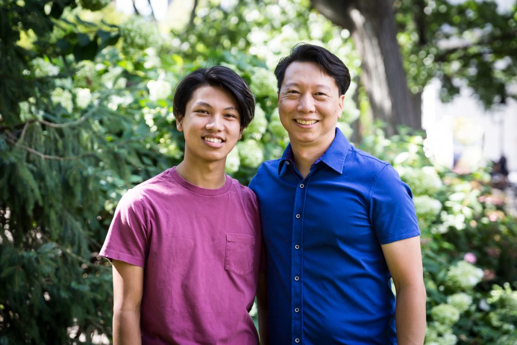 Young man and father during Washington Square Park family portrait