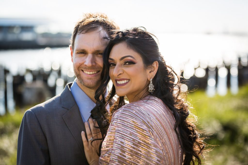 Bride and groom hugging in Brooklyn Bridge Park