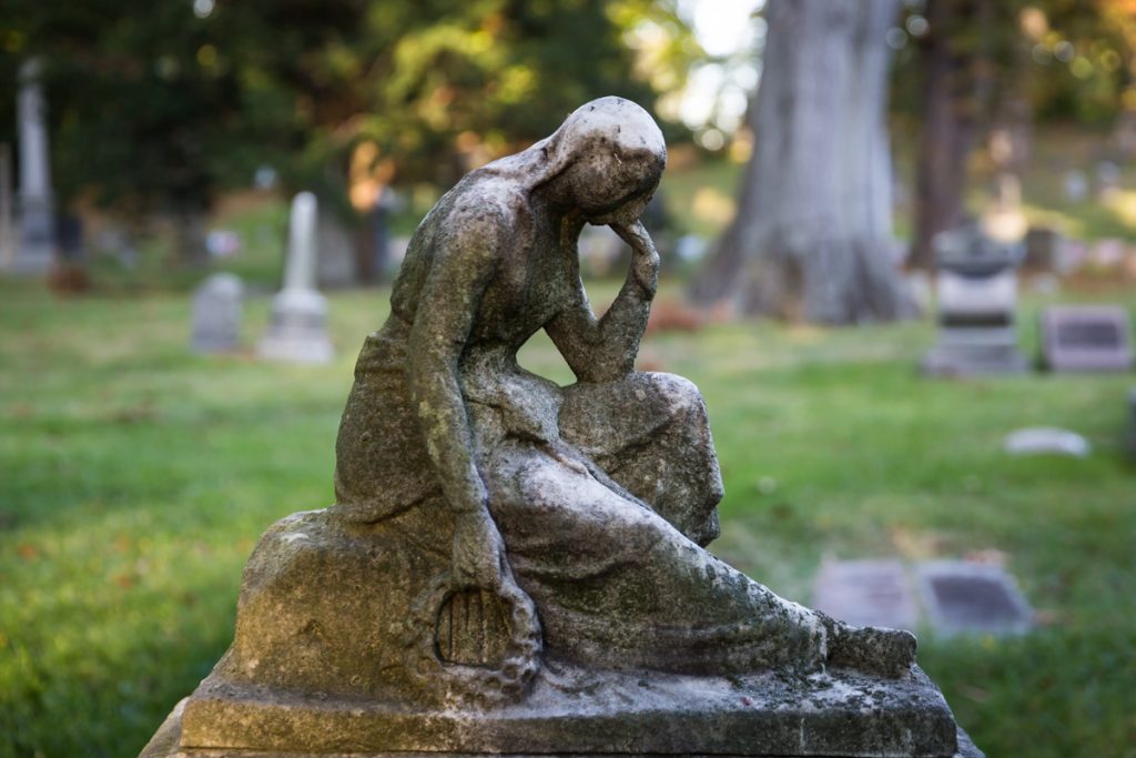 Grave statuary for an article on visiting Green-Wood Cemetery