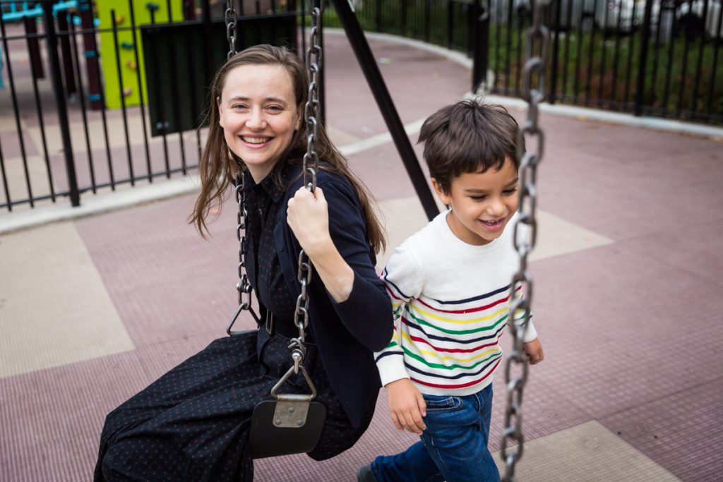 Mother and boy at swingset during a Gowanus family portrait session