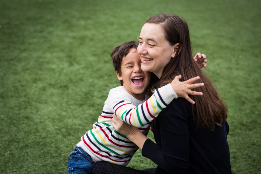 Boy hugging mother at an Ennis Playground family portrait session