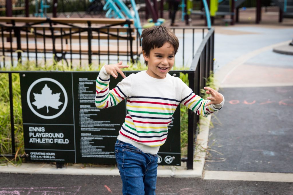 Young boy dancing at an Ennis Playground family portrait session