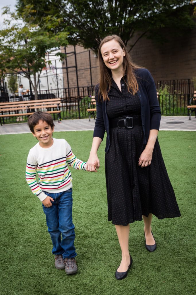 Mother and son holding hands and walking during a Gowanus family portrait session