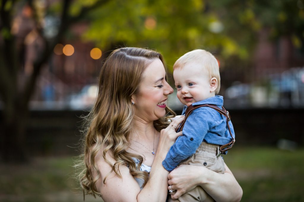 Mother playing with baby son during a Marcus Garvey Park family portrait session
