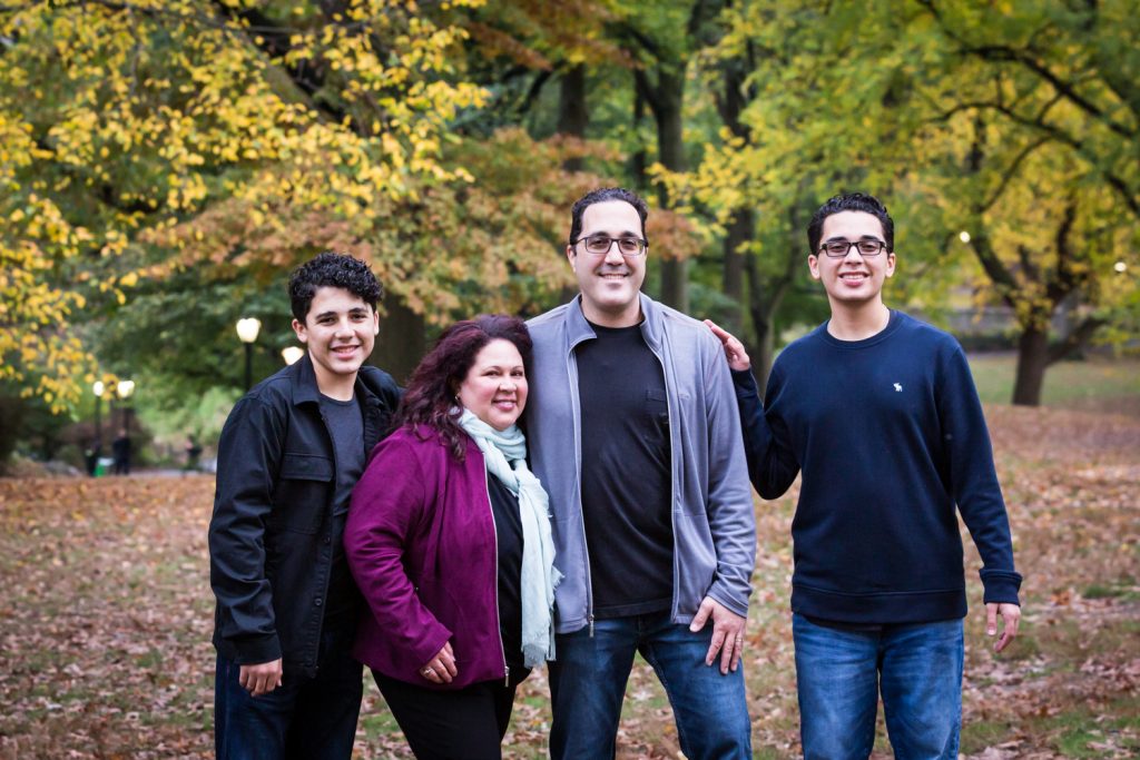 Family in forest during a Central Park senior portrait session